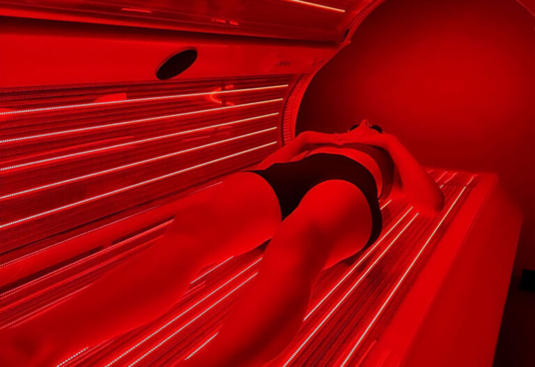 woman doing red light therapy in Scottsdale, AZ at The Peak