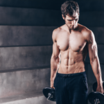 Lean muscular man representing muscle integrity, healthy aging, strength training, muscle preservation, recovery, and overall wellness