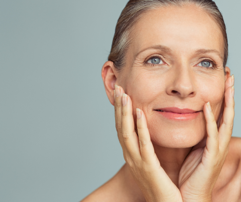 Beautiful mature woman with healthy skin illustrating the difference between collagen and elastin and healthy skin aging.