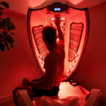 Client using the HyperT infrared sauna for heat therapy and hyperthermic conditioning at The Peak Wellness Spa in Scottsdale, Arizona.